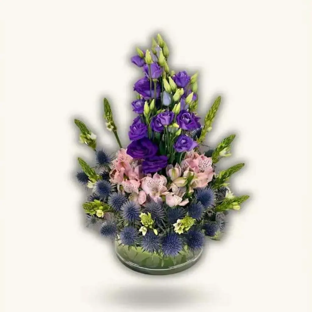 A Touch of Luxury A Glass Vase with Natural Roses in Purple and Pink